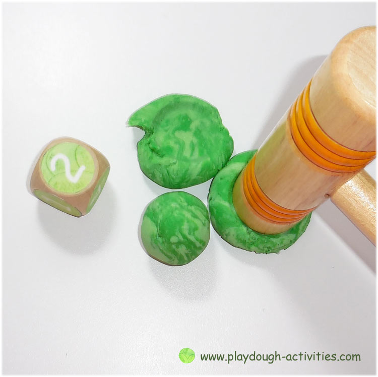 Roll the dice again and squash a matching number (or all) of the sprouts