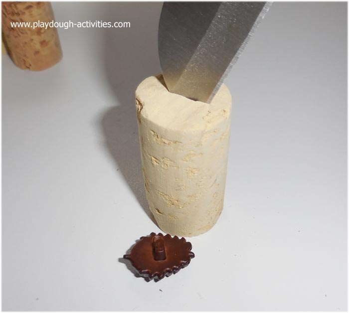 press a groove into the top of the cok to fit back fastening buttons in place
