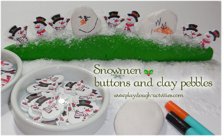 Christmas snowman buttons and airdry clay pebbles in hilly mounds of playdough