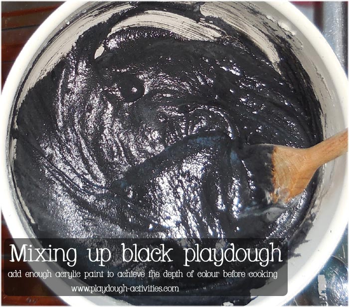 Mix up the black playdoug ingredients adding enough acrylic paint to achieve the deth of colour wanted before cooking