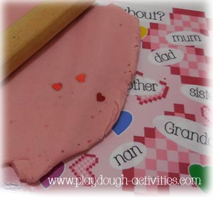 Roll sheets of dough to cover laminated images