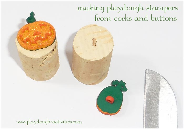 Makin pumpkin playdough stamps from buttons and corks