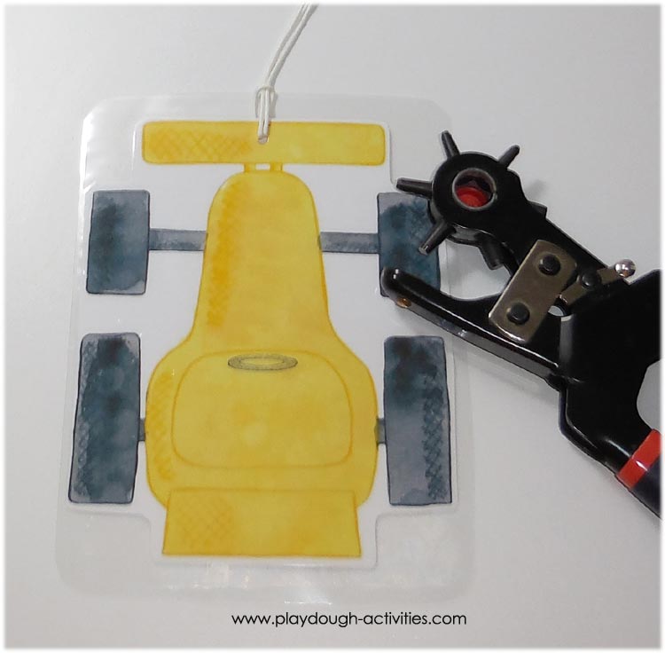 Hole punch cars to tie on string