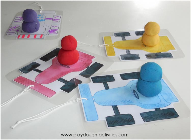 Build racing car driver's head and body from playdough