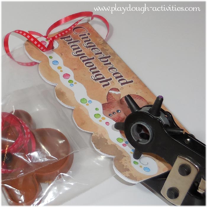 Attach the paper or card gingerbread playdough topper with a hole punch and curling ribbon