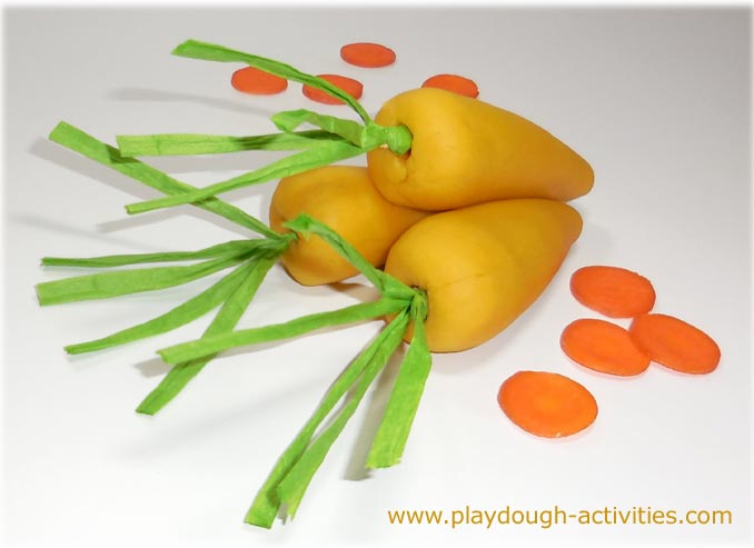 Carrot playdough made from puree dye for preschool children modelling activities