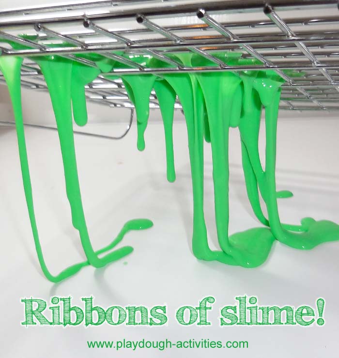 Ribbons of slime oozing through the grid of baking trays