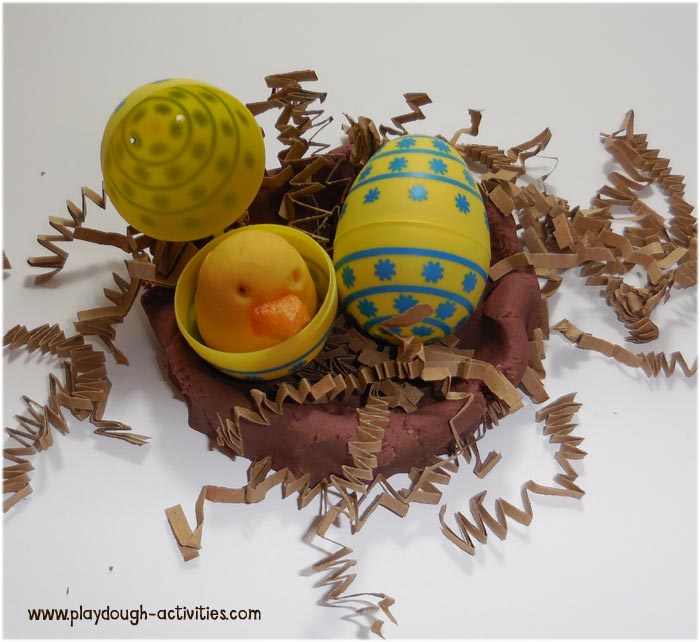 Playdough and packing paper shred bird nests for the season of spring